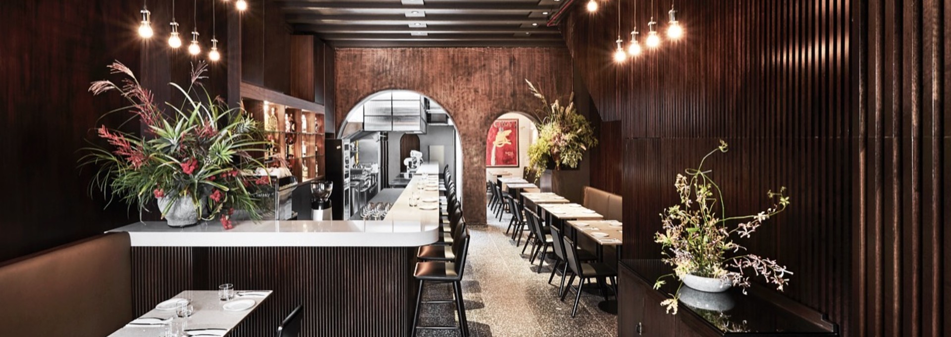 Experience the Essence of Venetian Design and Hospitality at Bar Cicheti, Singapore, design by Studio Königshausen. This Singaporean gem features a minimalist interior adorned with classic bistro elements, paying homage to Venetian Gothic architecture. 